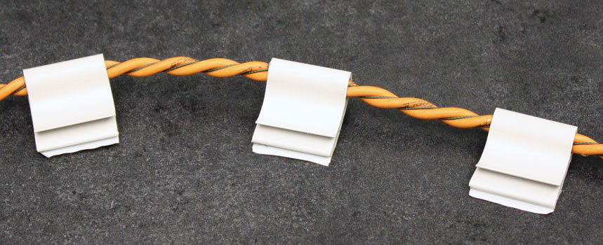 Use j-clips to secure a cable installation